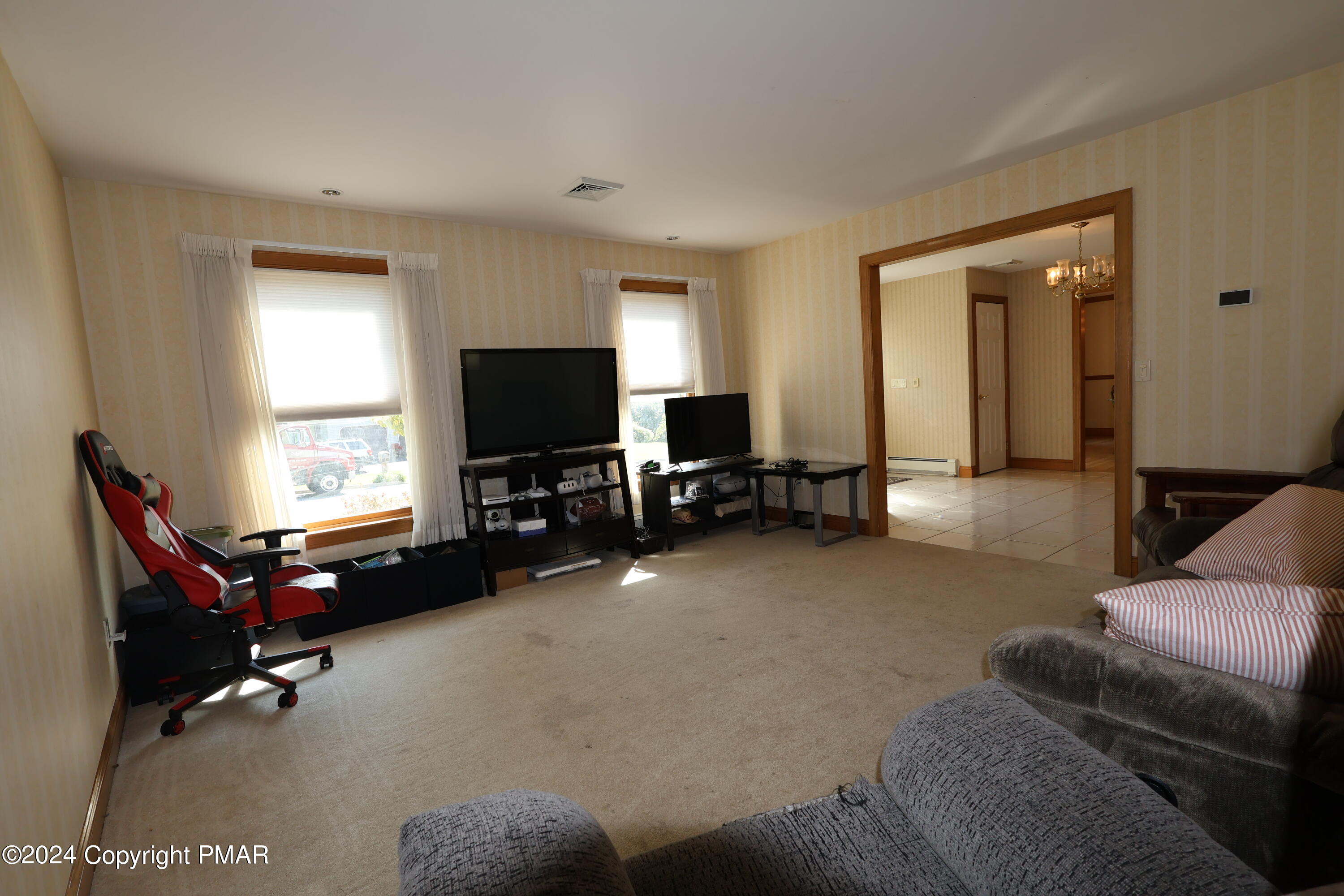 1179 Dotta Drive Pen Argyl, PA 18072 - Photo 21 of 39 a living room with furniture and a flat screen tv