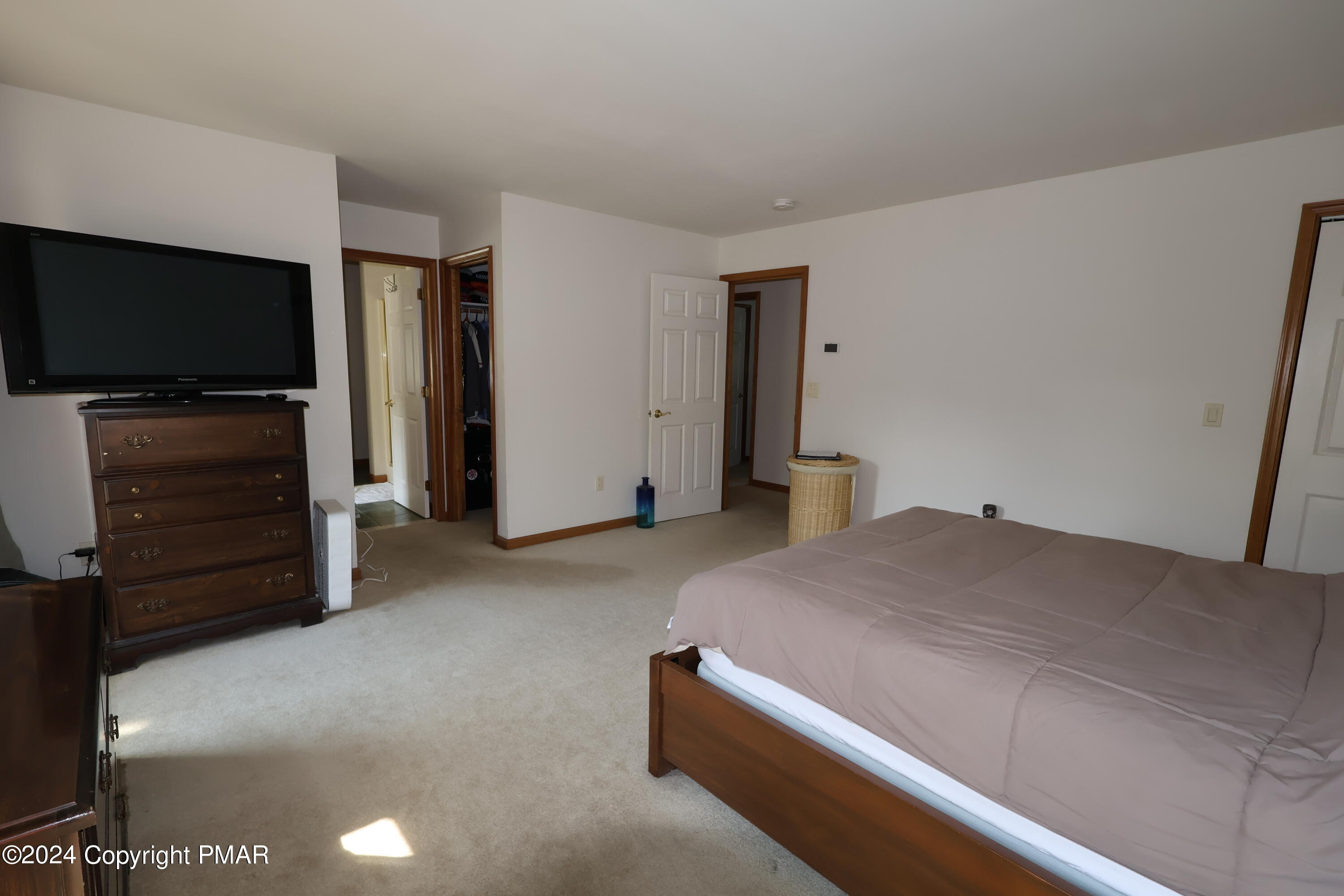 1179 Dotta Drive Pen Argyl, PA 18072 - Photo 22 of 39 a bedroom with a bed and a flat screen tv