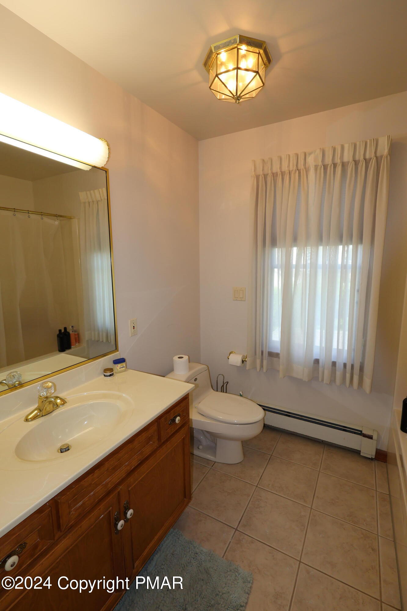 1179 Dotta Drive Pen Argyl, PA 18072 - Photo 34 of 39 a bathroom with a sink a toilet and a window
