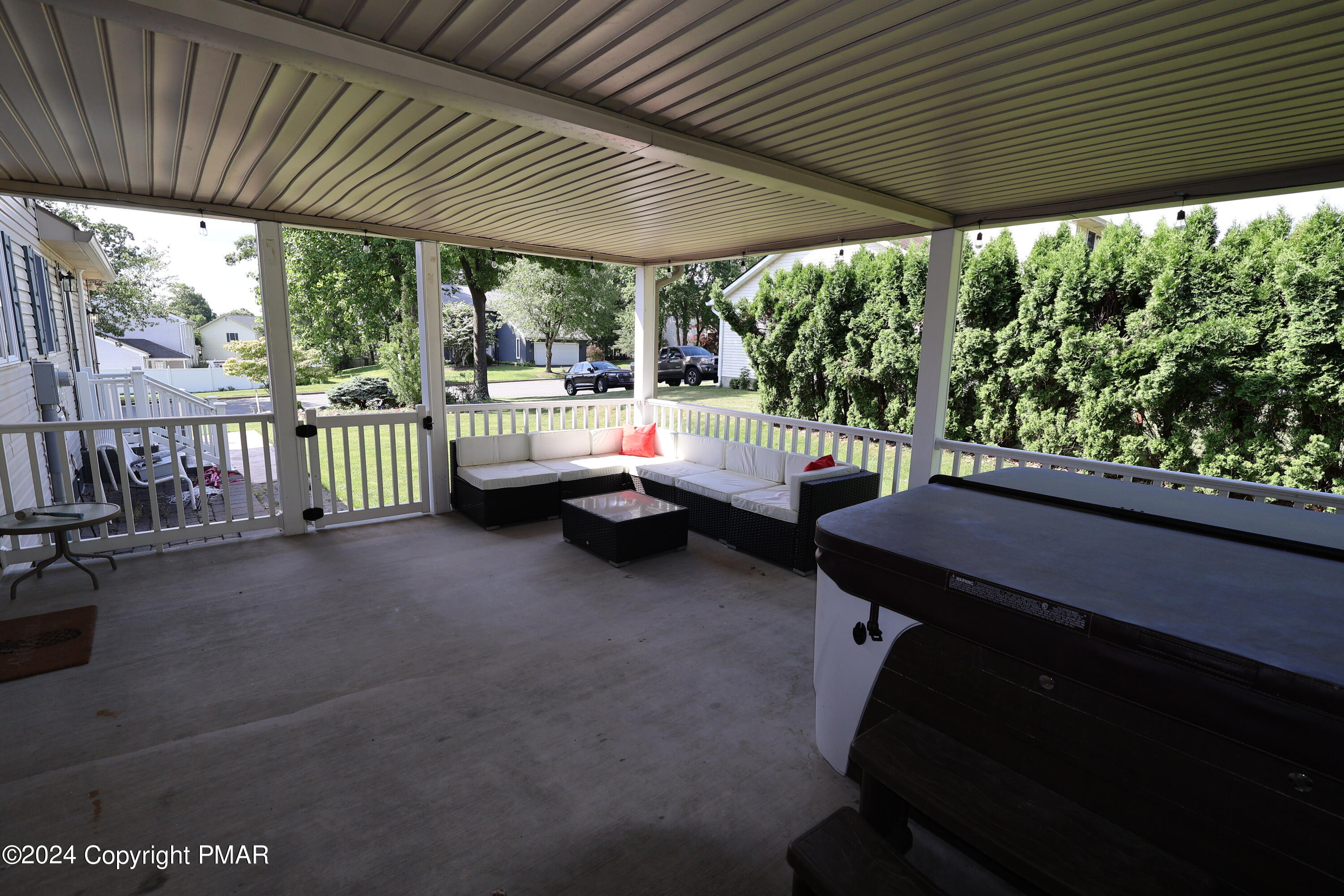 1179 Dotta Drive Pen Argyl, PA 18072 - Photo 6 of 39 a view of a patio with a table chairs and a couple of flower plants