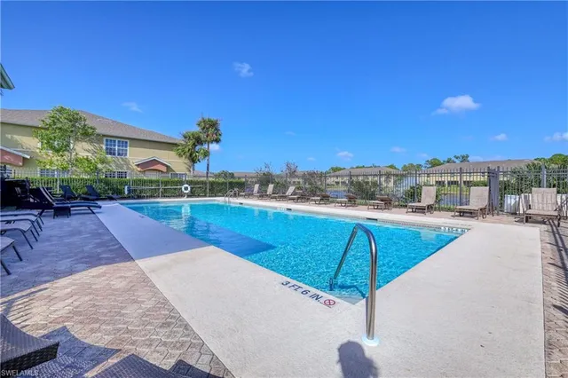a view of a swimming pool with a lounge chairs