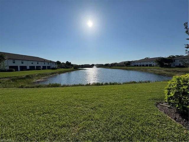 a view of a lake in a field