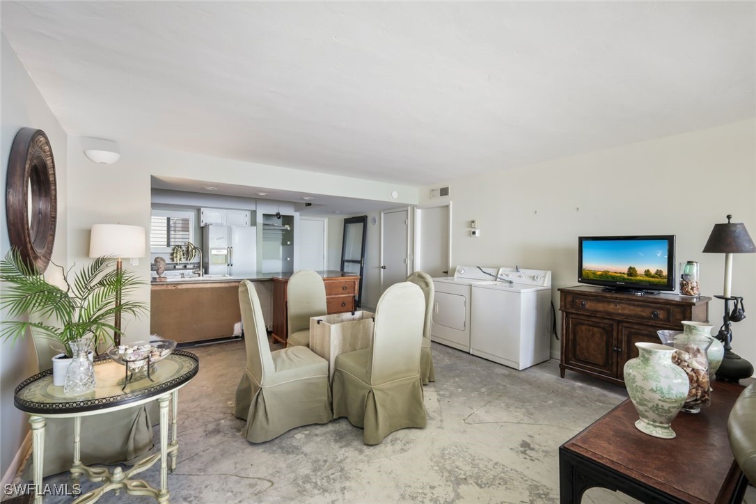15021 Punta Rassa Road, Unit 902 Fort Myers, FL 33908 - Photo 11 of 31 a living room with furniture a flat screen tv and a window