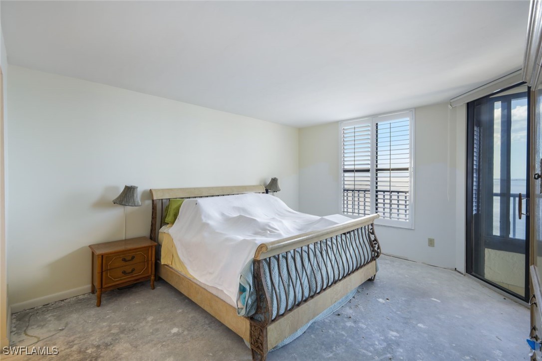 15021 Punta Rassa Road, Unit 902 Fort Myers, FL 33908 - Photo 12 of 31 a bedroom with a bed and a window