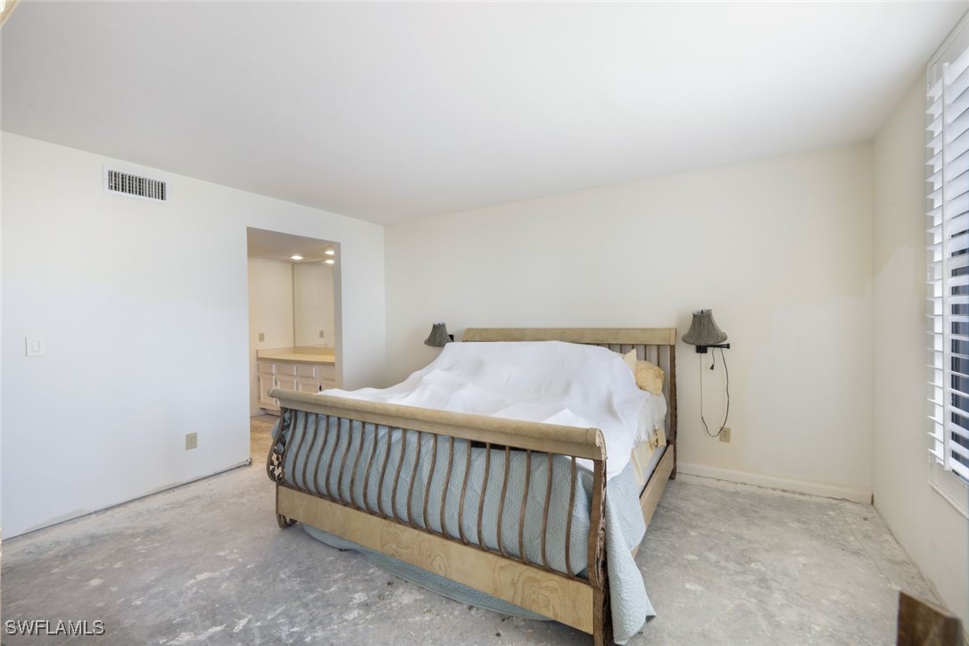 15021 Punta Rassa Road, Unit 902 Fort Myers, FL 33908 - Photo 18 of 31 a bedroom with a bed and a window