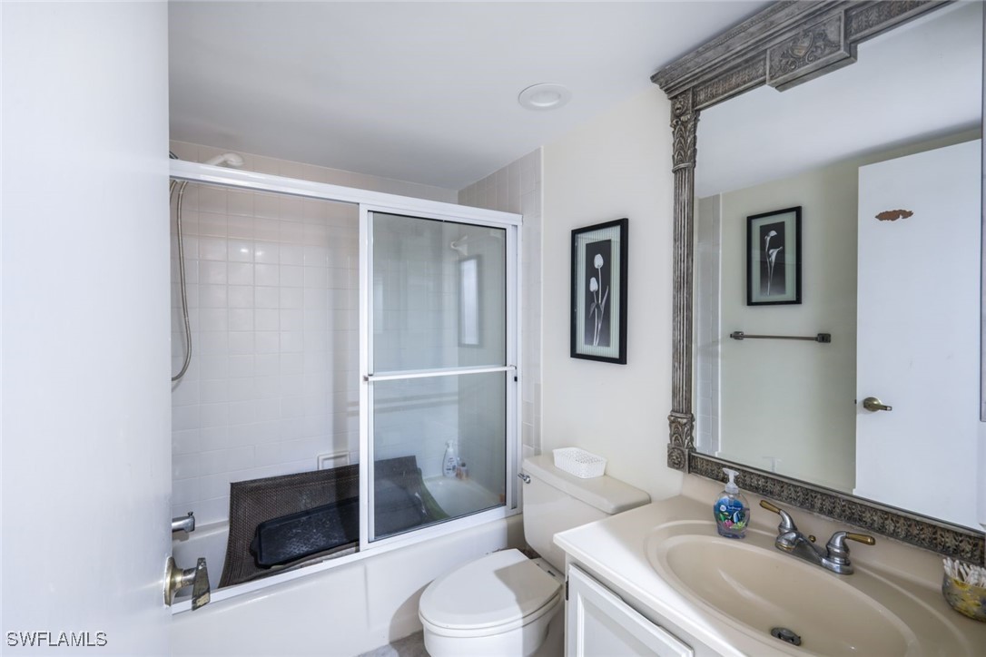 15021 Punta Rassa Road, Unit 902 Fort Myers, FL 33908 - Photo 19 of 31 a bathroom with a sink toilet and shower