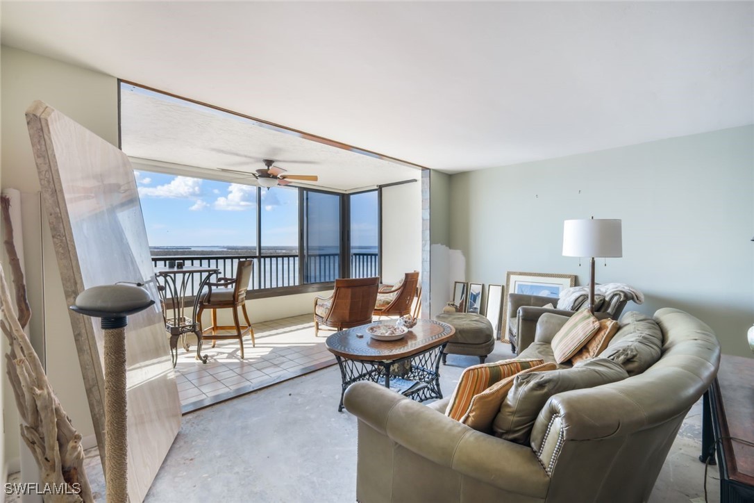 15021 Punta Rassa Road, Unit 902 Fort Myers, FL 33908 - Photo 2 of 31 a living room with furniture and a large window