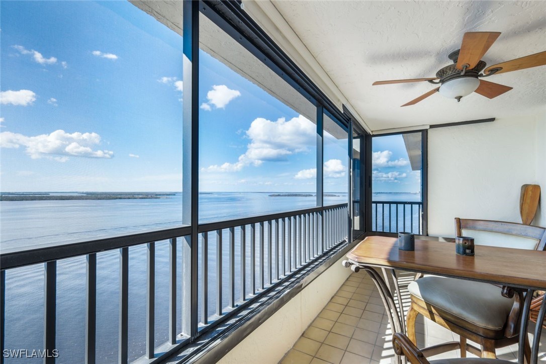 15021 Punta Rassa Road, Unit 902 Fort Myers, FL 33908 - Photo 21 of 31 a view of a balcony dining area with furniture