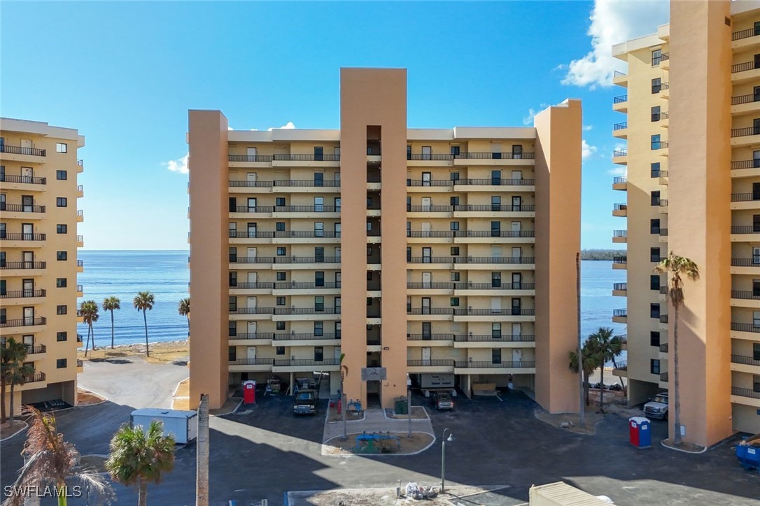 15021 Punta Rassa Road, Unit 902 Fort Myers, FL 33908 - Photo 27 of 31 a front view of a building with glass windows