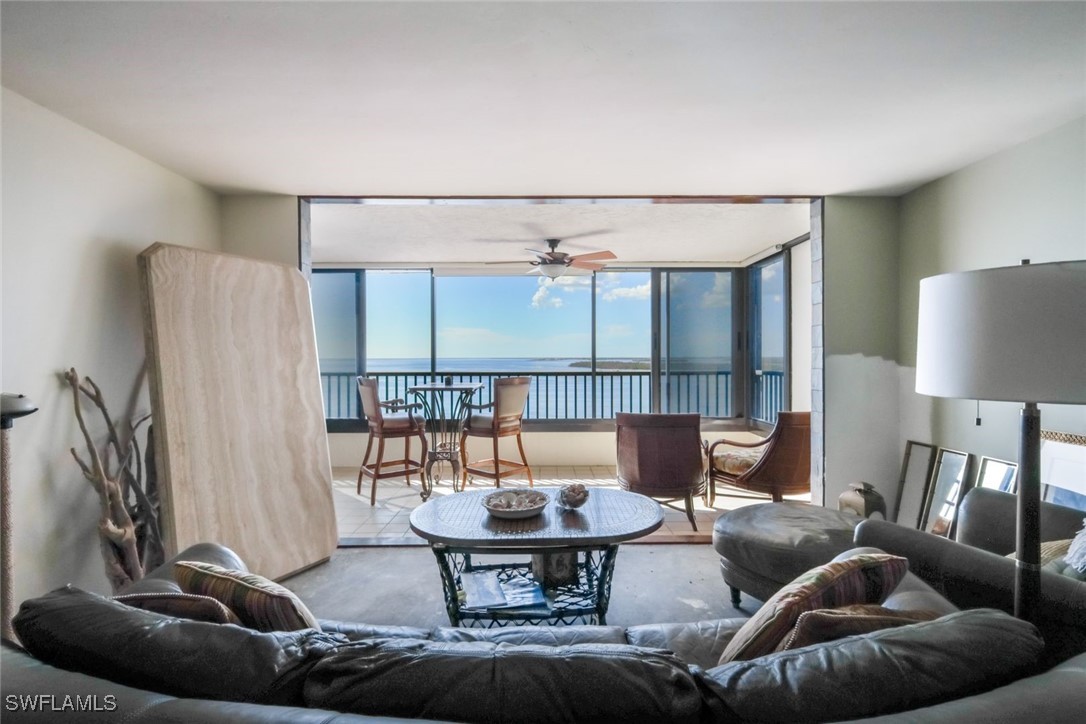 15021 Punta Rassa Road, Unit 902 Fort Myers, FL 33908 - Photo 3 of 31 a living room with furniture and a window