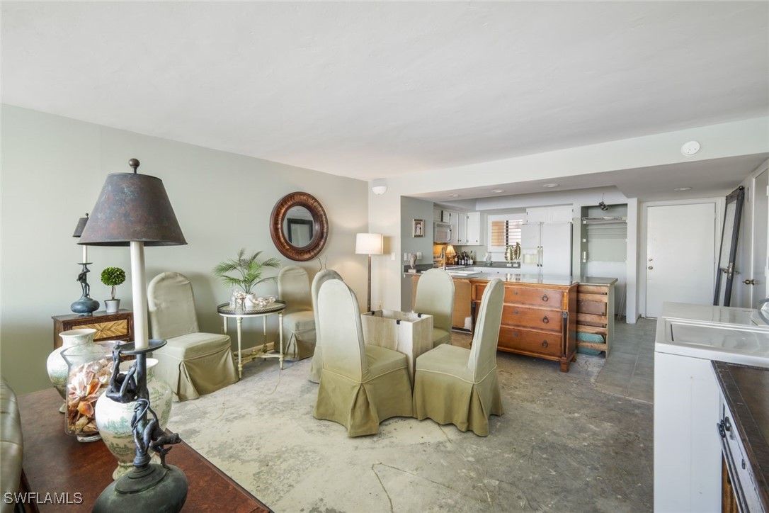15021 Punta Rassa Road, Unit 902 Fort Myers, FL 33908 - Photo 8 of 31 a view of a dining room with furniture