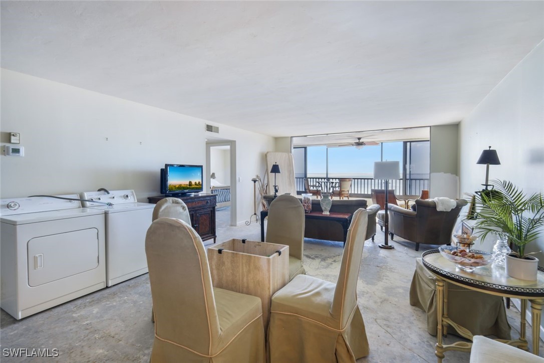 15021 Punta Rassa Road, Unit 902 Fort Myers, FL 33908 - Photo 10 of 31 a living room with furniture kitchen view and a potted plant