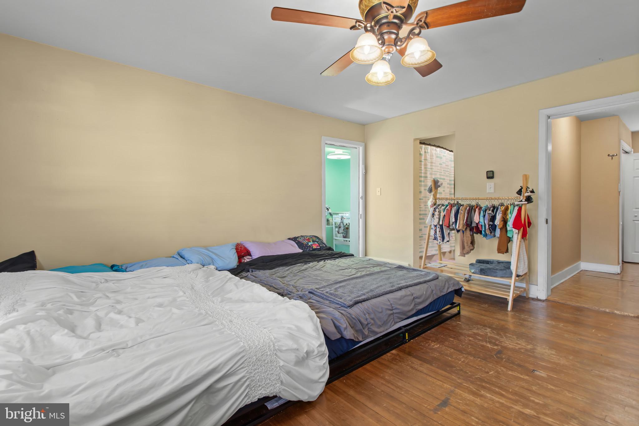 702 West Main Street Waynesboro, PA 17268 - Photo 17 of 32 a bedroom with a bed and a chandelier