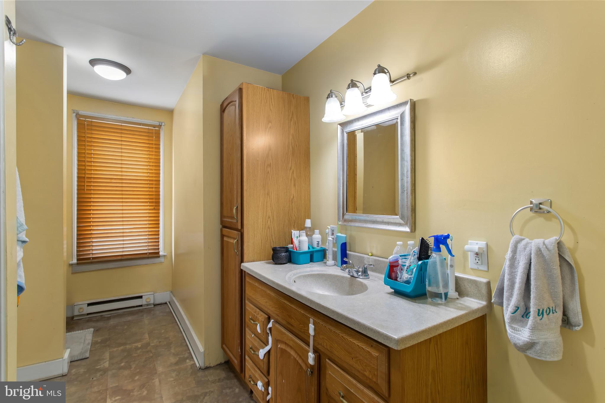 702 West Main Street Waynesboro, PA 17268 - Photo 19 of 32 a bathroom with a sink vanity and a mirror