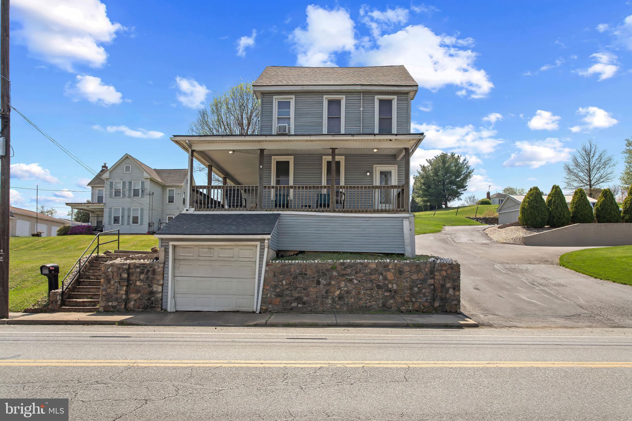 702 West Main Street Waynesboro, PA 17268 - Photo 2 of 32 a front view of a house with garden