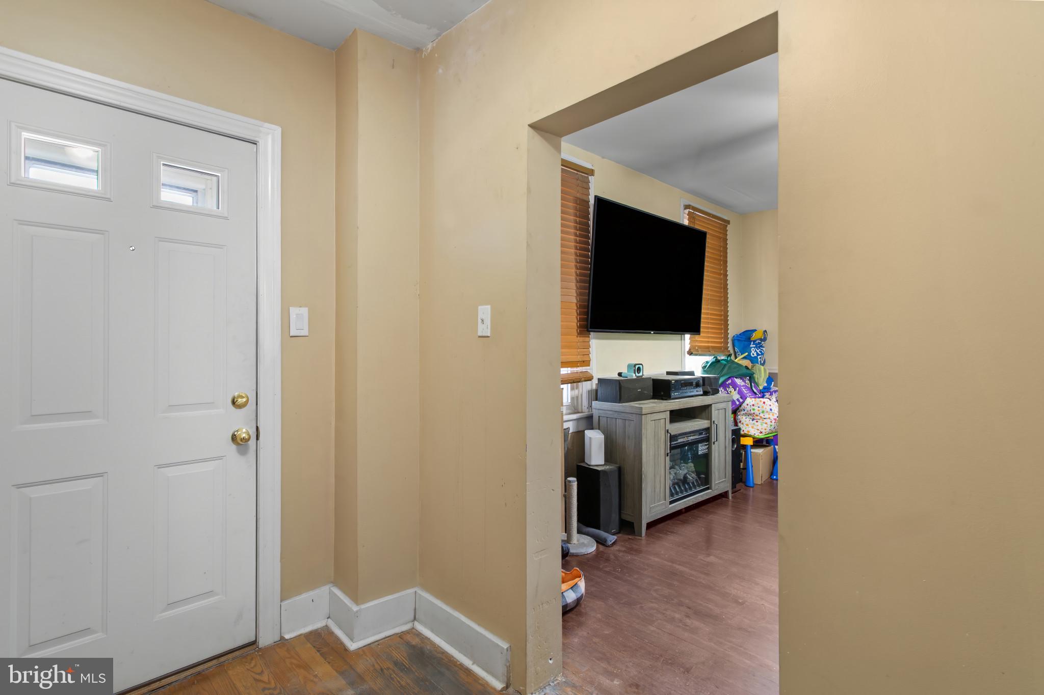 702 West Main Street Waynesboro, PA 17268 - Photo 6 of 32 a view of a workspace with a flat screen tv