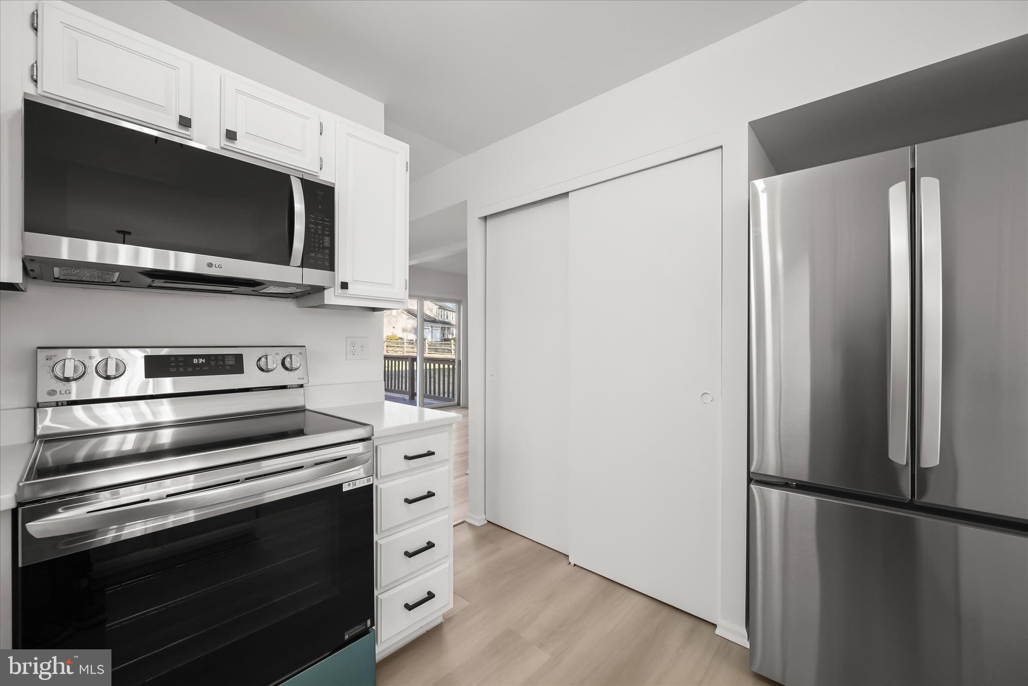 9344 Spring Water Path Jessup, MD 20794 - Photo 17 of 61 a kitchen with stainless steel appliances and refrigerator