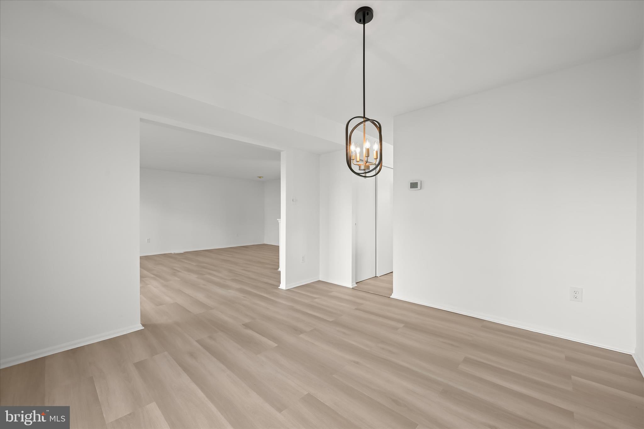 9344 Spring Water Path Jessup, MD 20794 - Photo 20 of 61 a view of a room with wooden floor and fan