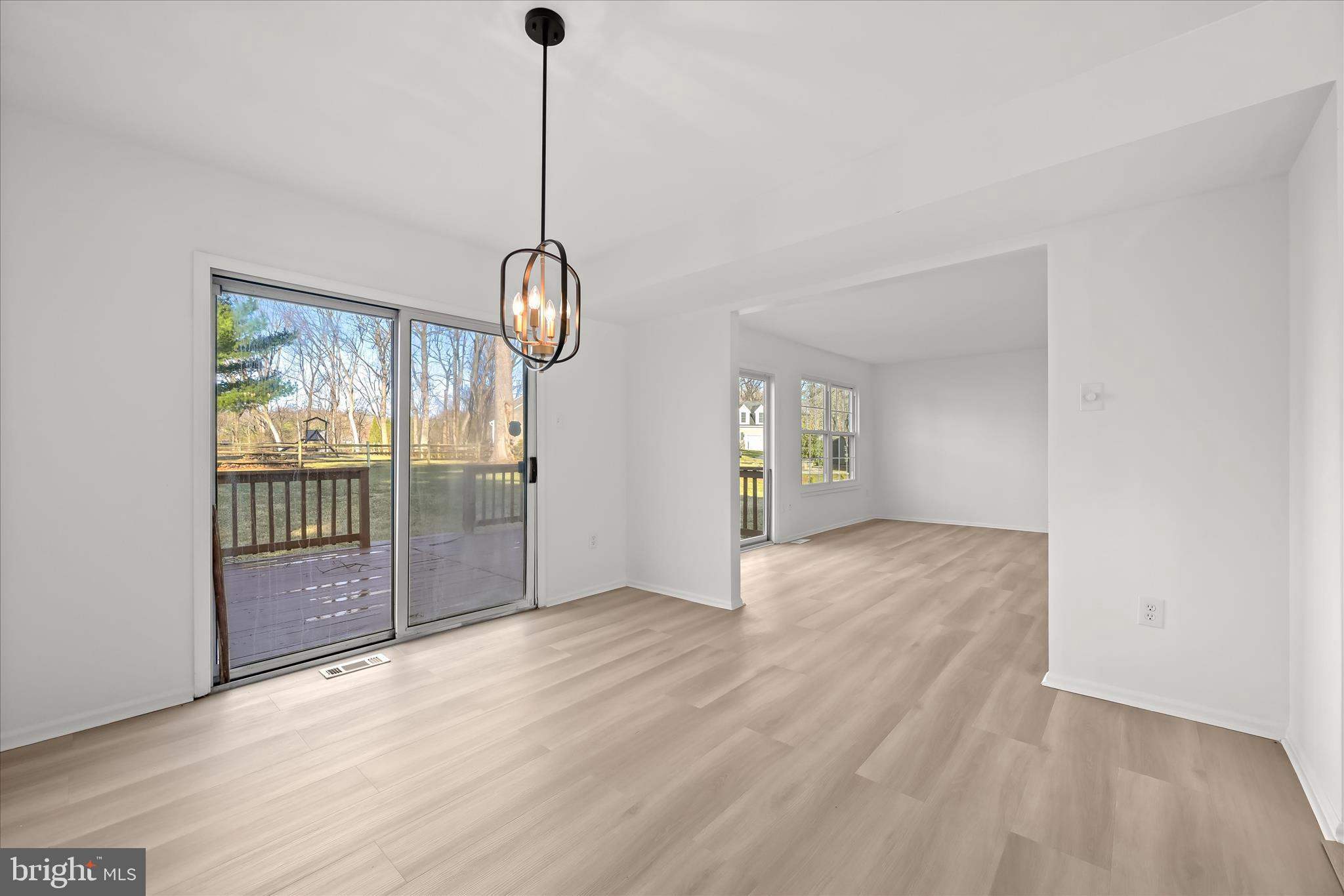 9344 Spring Water Path Jessup, MD 20794 - Photo 21 of 61 a view of empty room with wooden floor and fan