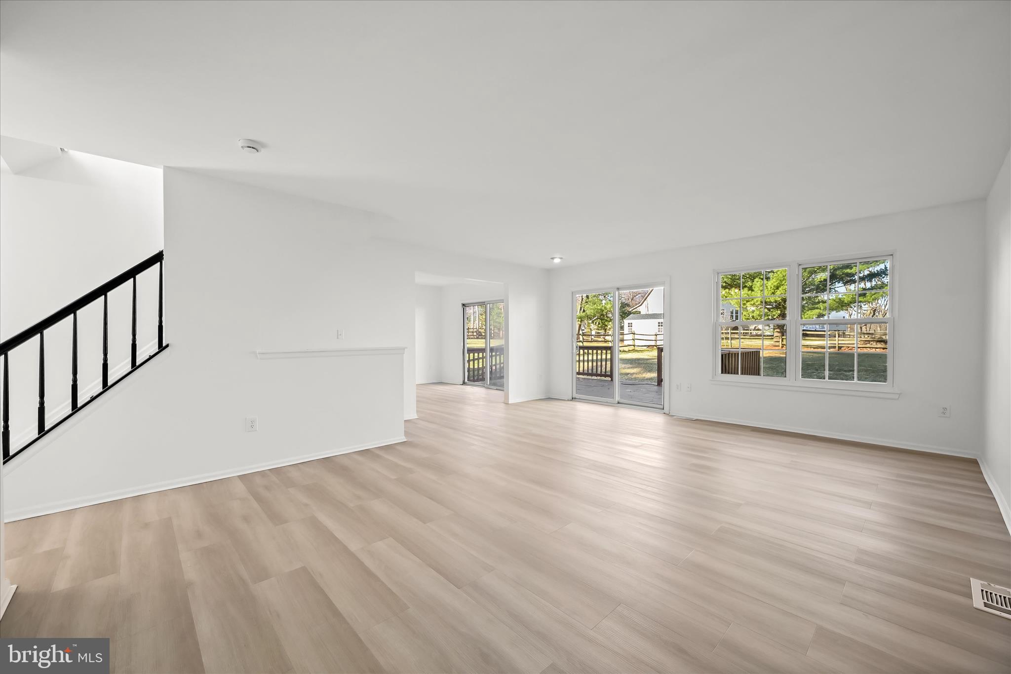9344 Spring Water Path Jessup, MD 20794 - Photo 24 of 61 a view of an empty room with a window and wooden floor
