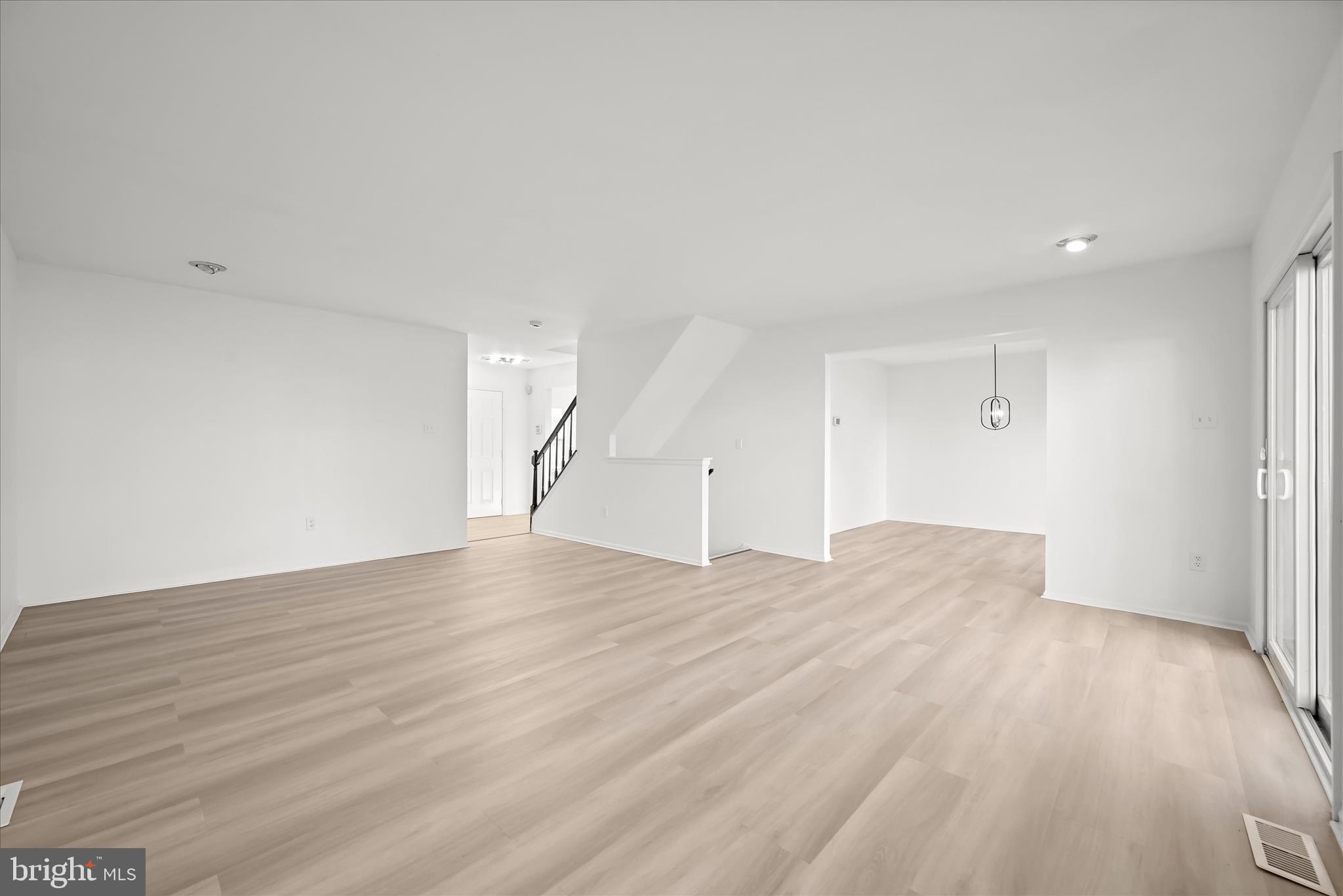 9344 Spring Water Path Jessup, MD 20794 - Photo 26 of 61 a view of empty room with wooden floor