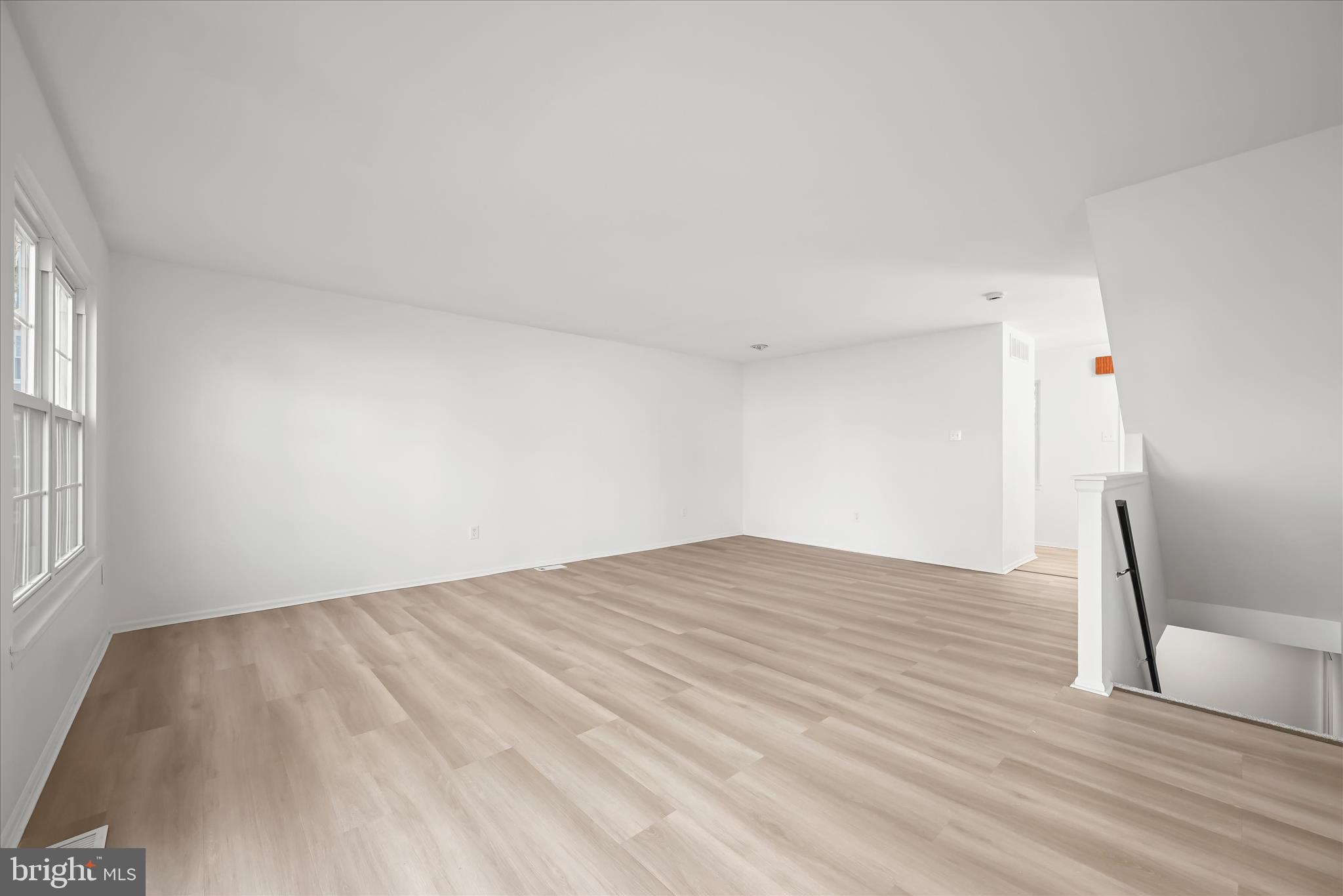9344 Spring Water Path Jessup, MD 20794 - Photo 27 of 61 a view of empty room with wooden floor and fan