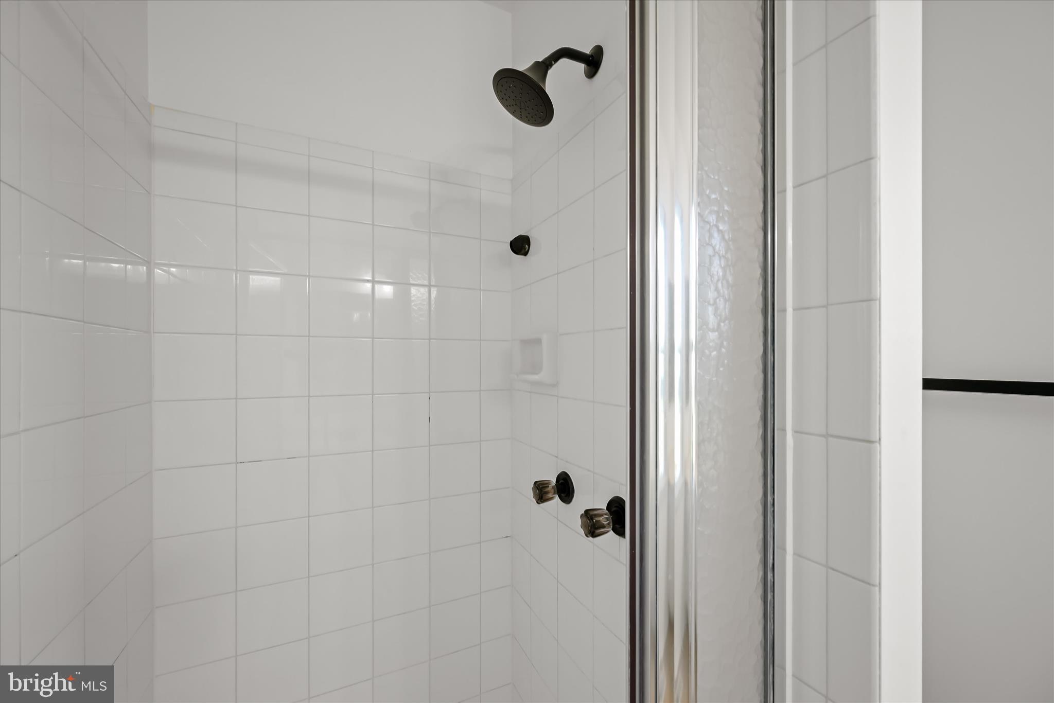 9344 Spring Water Path Jessup, MD 20794 - Photo 35 of 61 a bathroom with a shower