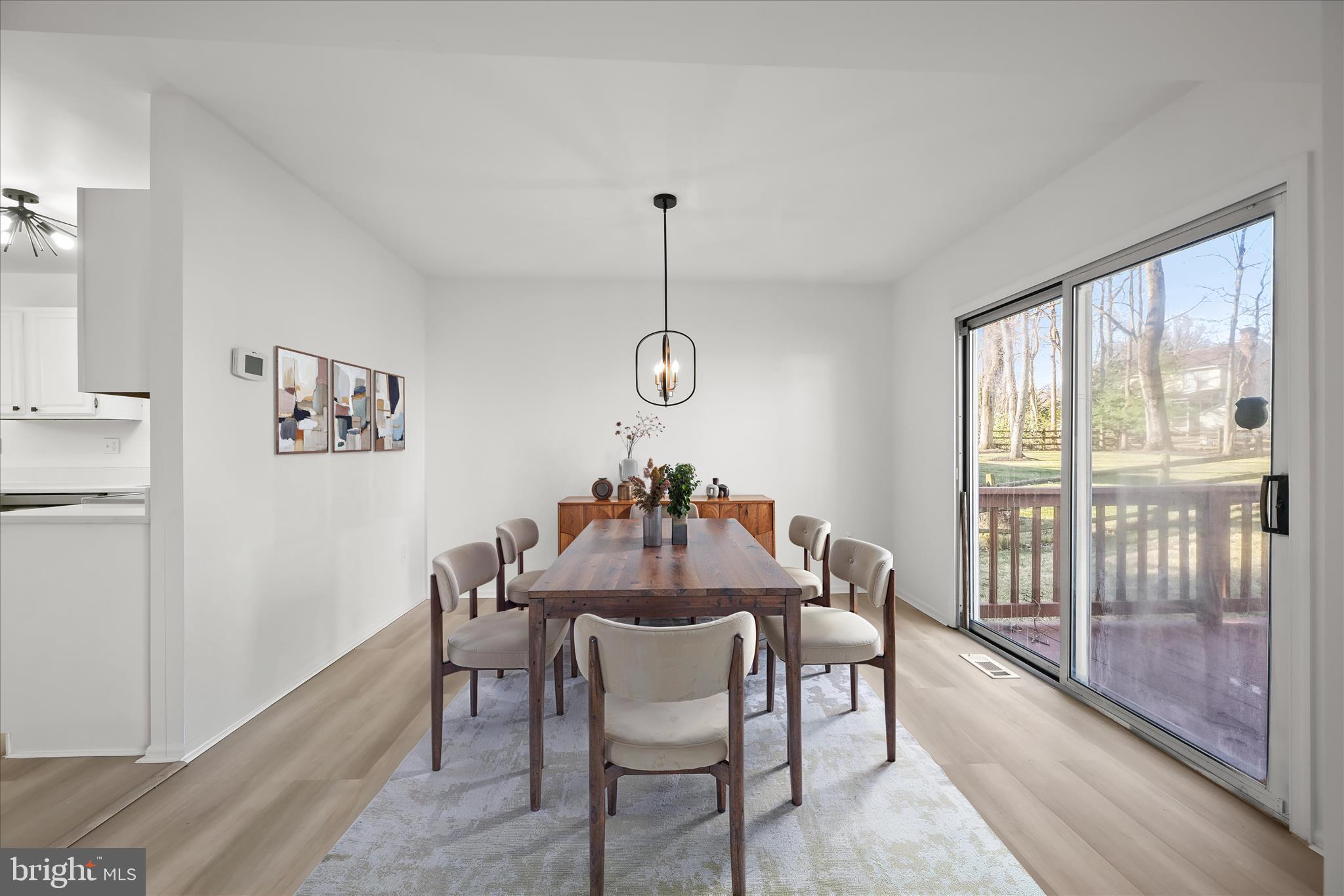 9344 Spring Water Path Jessup, MD 20794 - Photo 4 of 61 a view of a dining room with furniture window and outside view