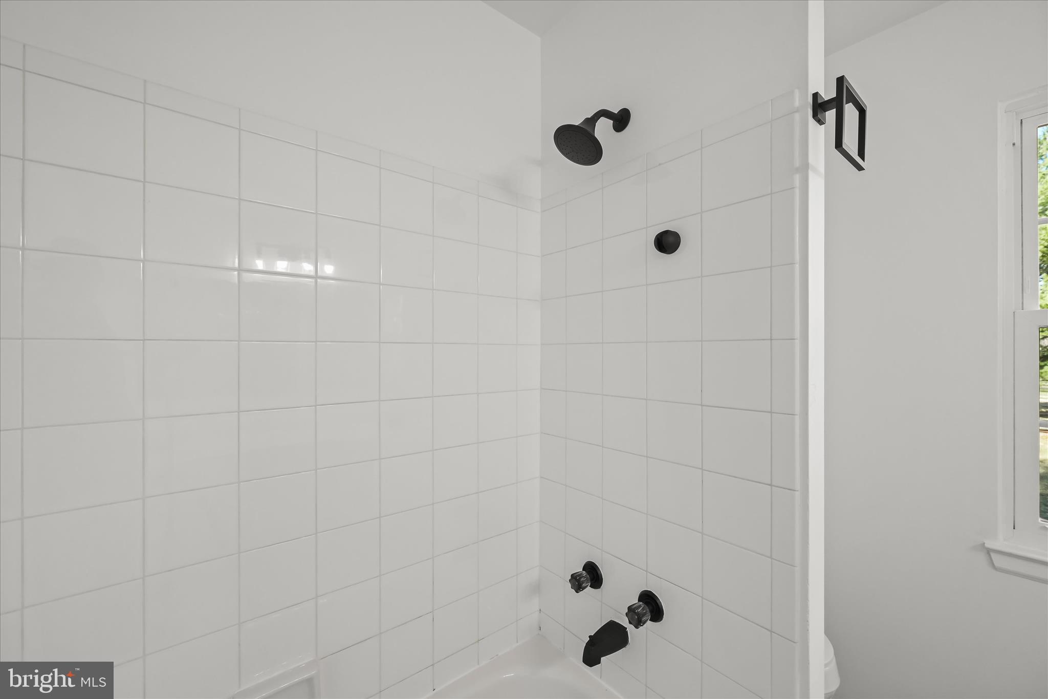9344 Spring Water Path Jessup, MD 20794 - Photo 43 of 61 a bathroom with a bathtub