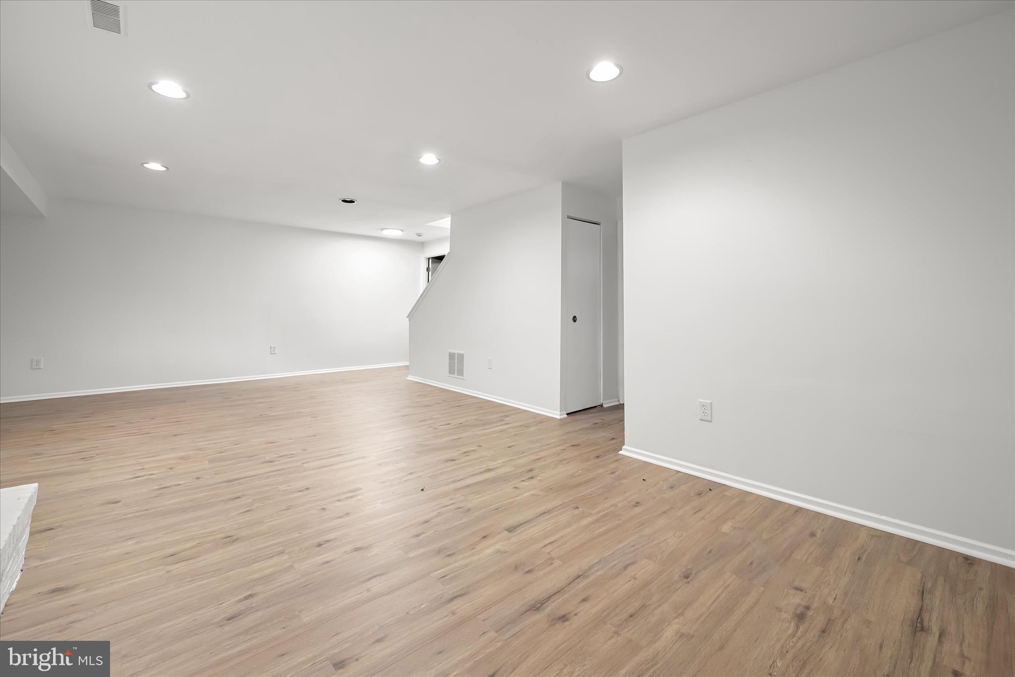 9344 Spring Water Path Jessup, MD 20794 - Photo 49 of 61 an empty room with wooden floor and windows