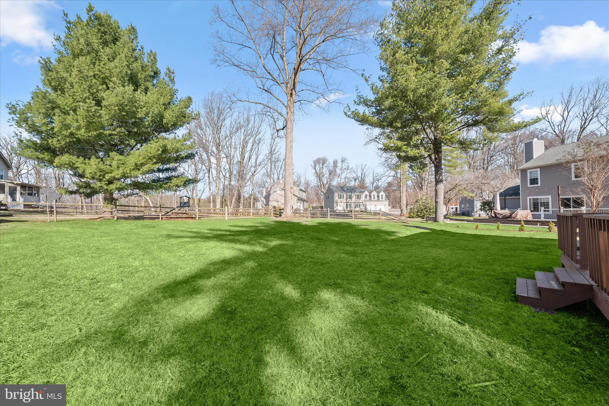 9344 Spring Water Path Jessup, MD 20794 - Photo 56 of 61 a garden with trees in front of it