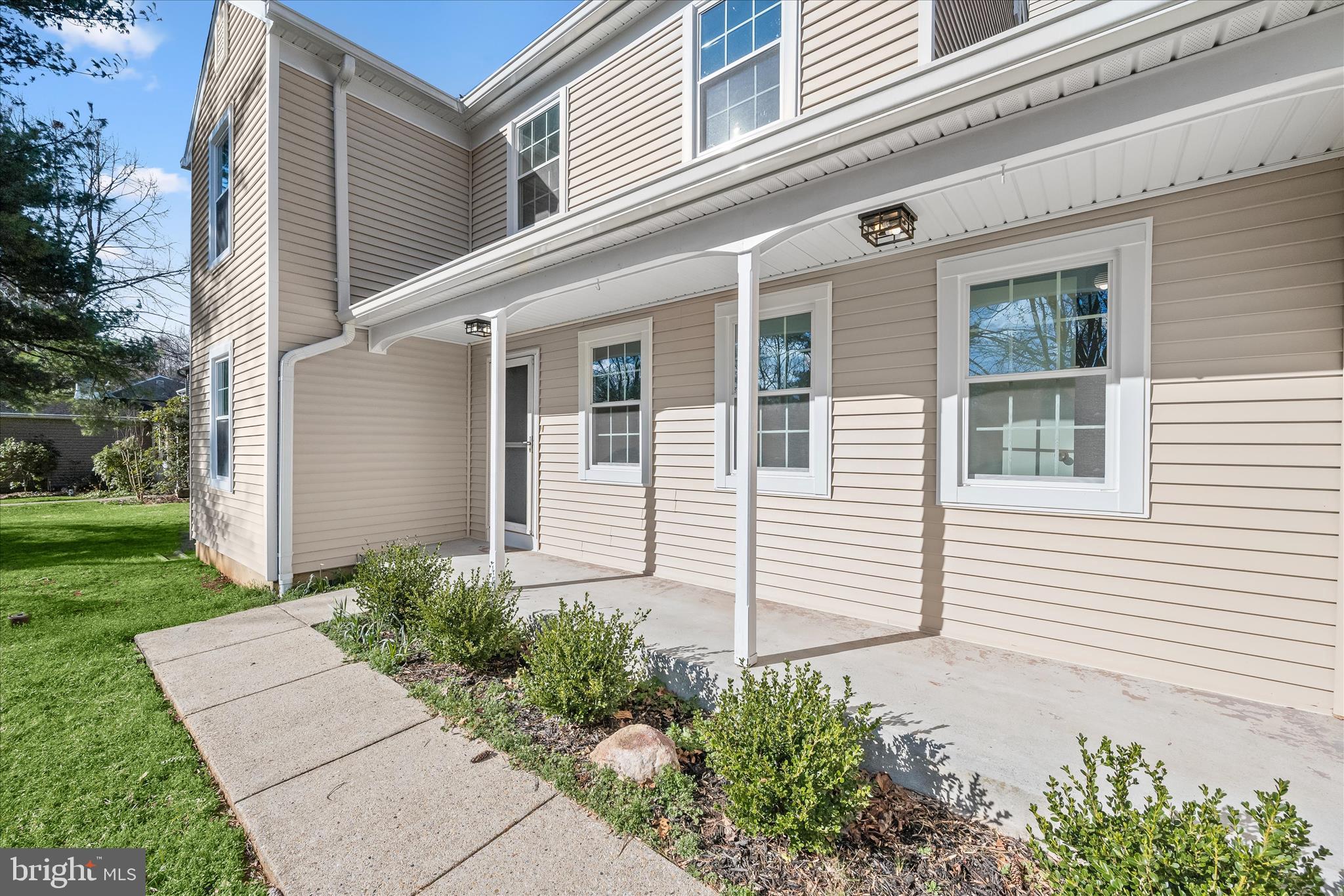 9344 Spring Water Path Jessup, MD 20794 - Photo 7 of 61 a front view of a house with a yard