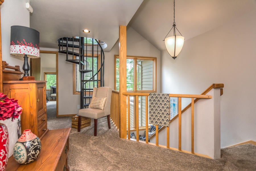 17691 Bittern Lane Sunriver, OR 97707 - Photo 11 of 18 This central landing provides access to the master suite and guest rooms. The spiral staircase leads to the loft.
