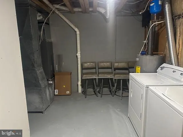 view of living room with furniture and a gate