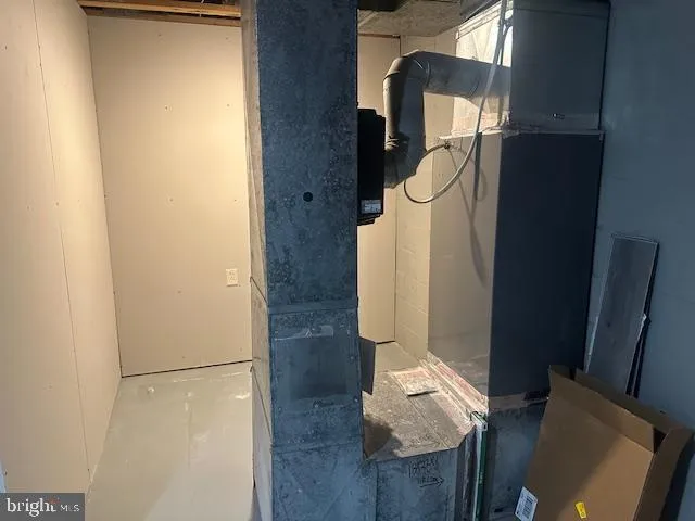 a wooden bench sitting in middle of a yard