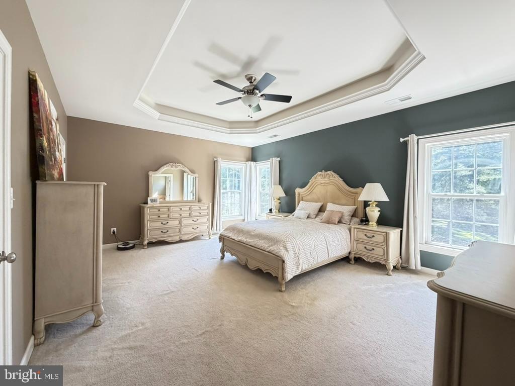 9804 Anvil Court Perry Hall, MD 21128 - Photo 11 of 21 a spacious bedroom with a bed and a chandelier