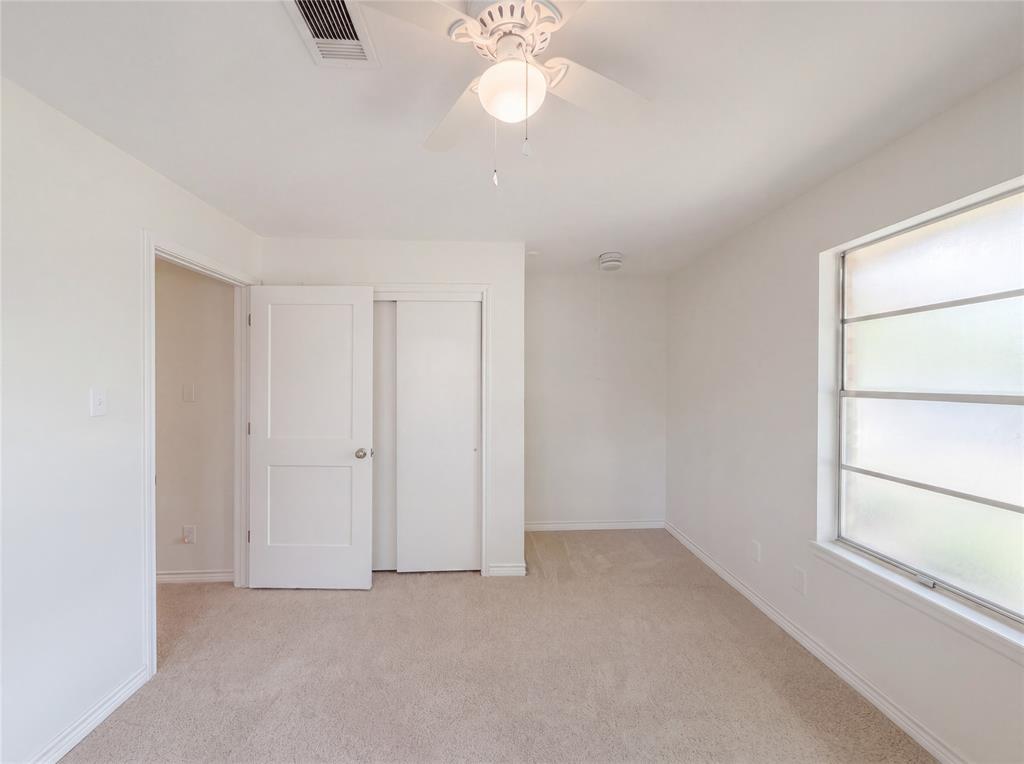 205 West Decatur Street Chico, TX 76431 - Photo 13 of 19 a view of an empty room with a window