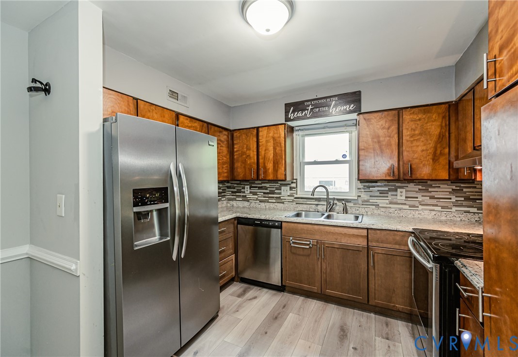 709 Deter Road Richmond, VA 23225 - Photo 5 of 38 Kitchen featuring wood cabinetry, stainless steel