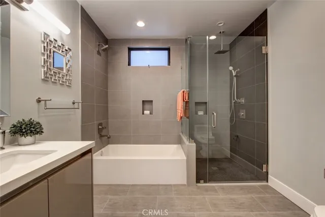 a bathroom with a bathtub and a sink