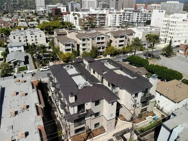 an aerial view of residential houses with outdoor space