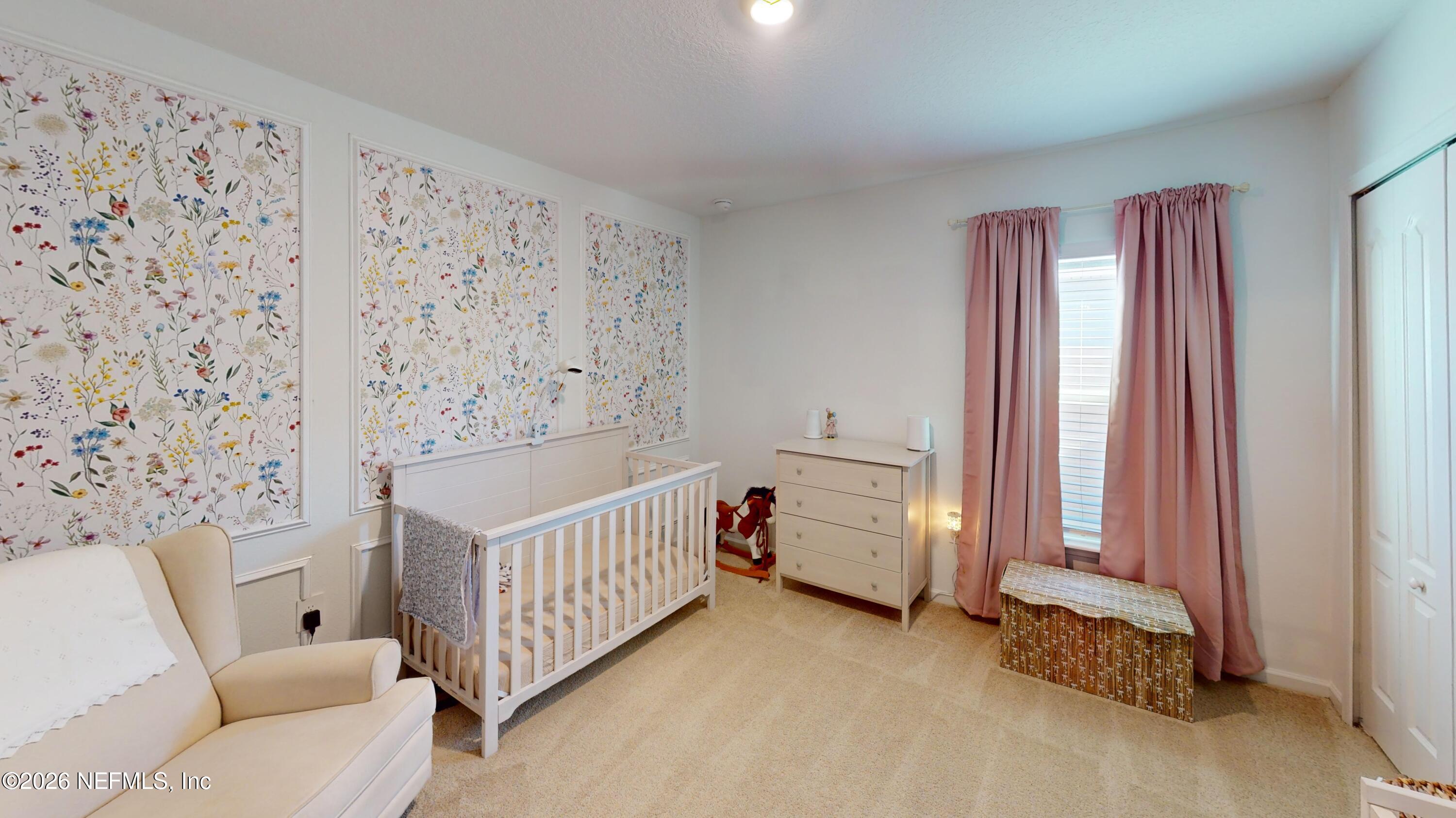 70625 Turtle Creek Yulee, FL 32097 - Photo 13 of 19 a view of a bedroom with furniture and window