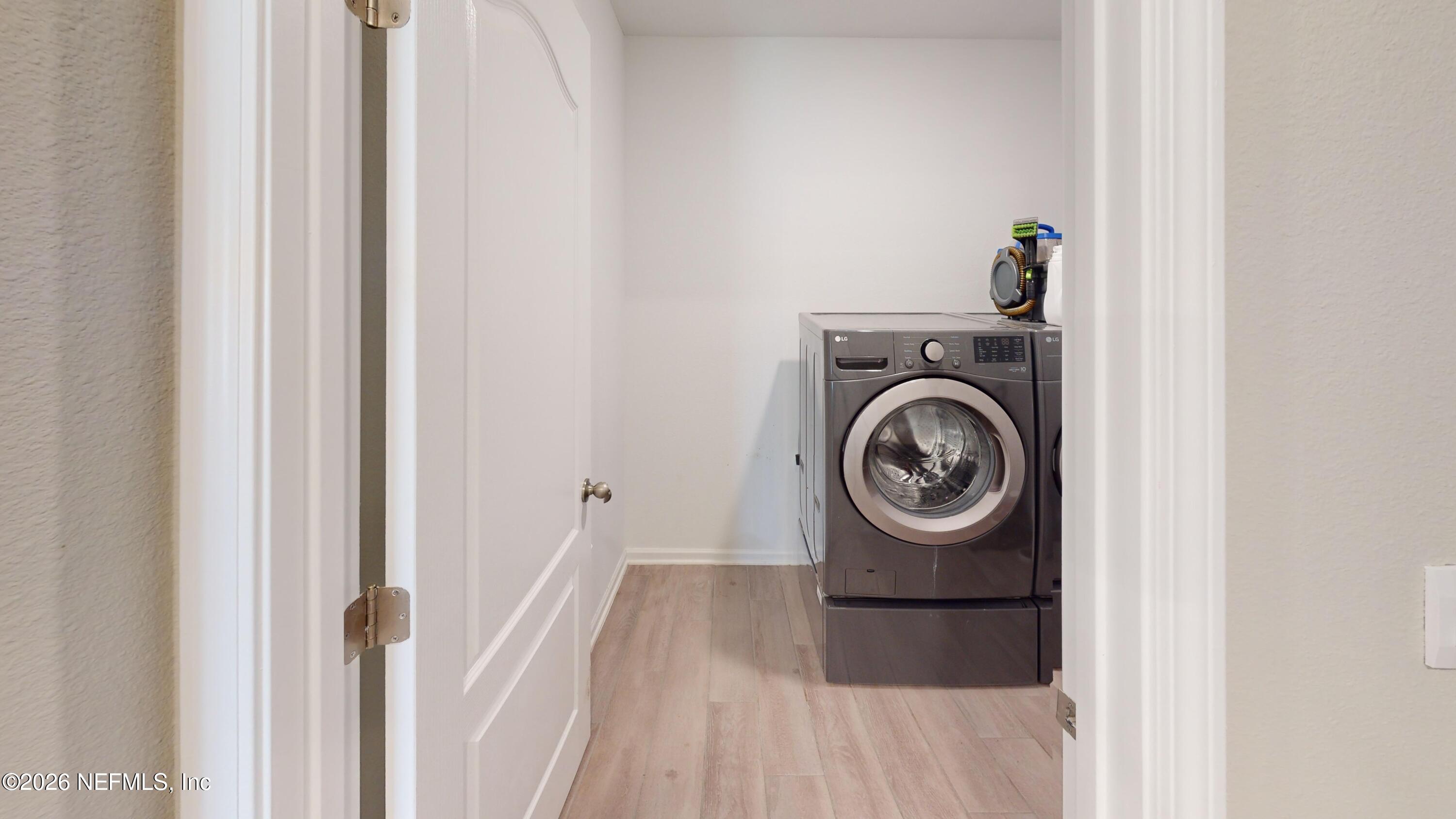 70625 Turtle Creek Yulee, FL 32097 - Photo 16 of 19 a close view of a utility room with dryer and washer