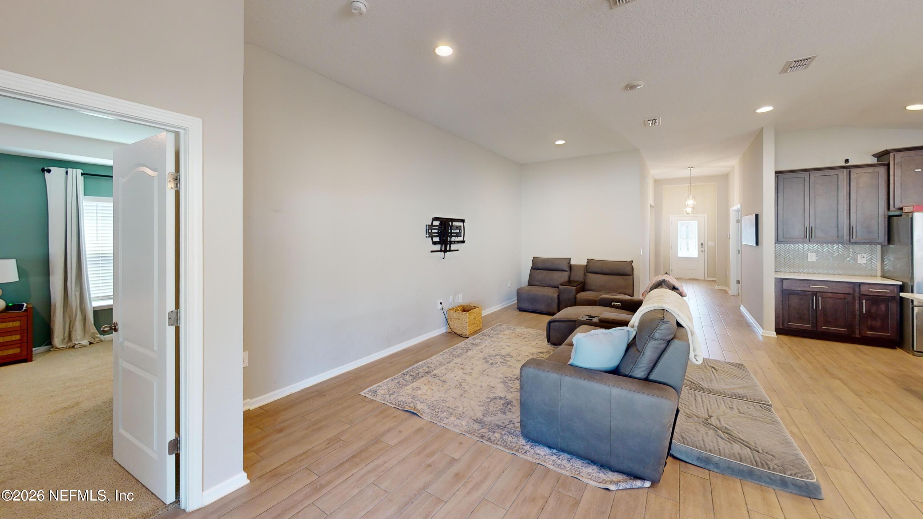 70625 Turtle Creek Yulee, FL 32097 - Photo 4 of 19 a living room with furniture and a couch