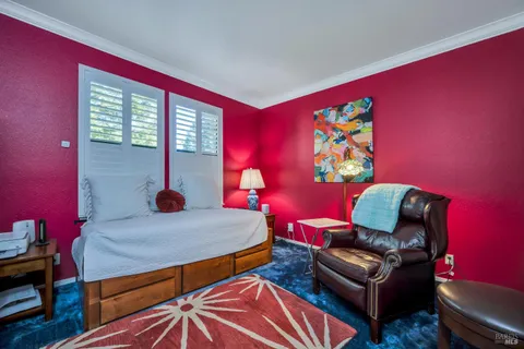 a bathroom with a sink mirror vanity and toilet