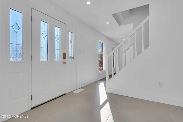 a view of a hallway with staircase