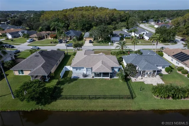 an aerial view of a houses with outdoor space and street view