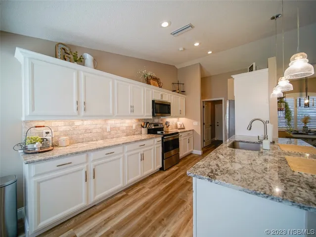 a bedroom with furniture a rug and a window