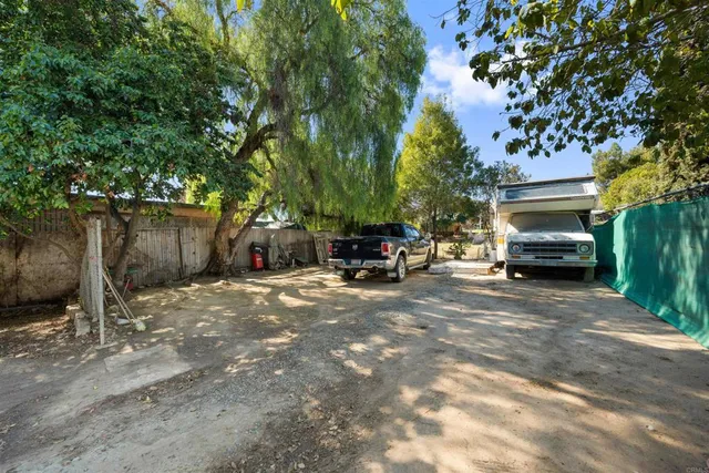 a view of a house with a wooden deck