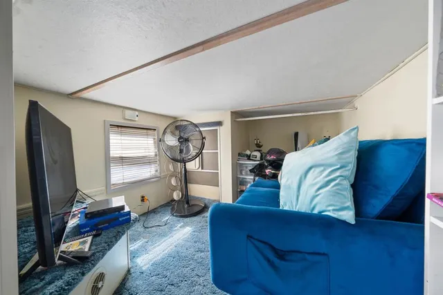 a kitchen with a stove a sink and a refrigerator