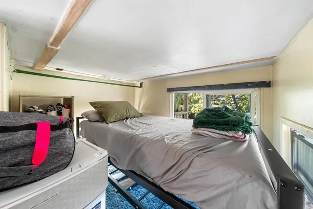 a bathroom with a toilet and a window